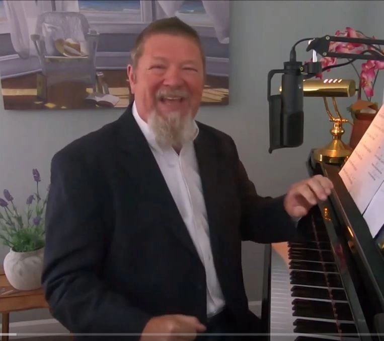 Rob Fisk, piano tuner, at the piano